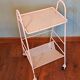 Perforated white metal serving trolley