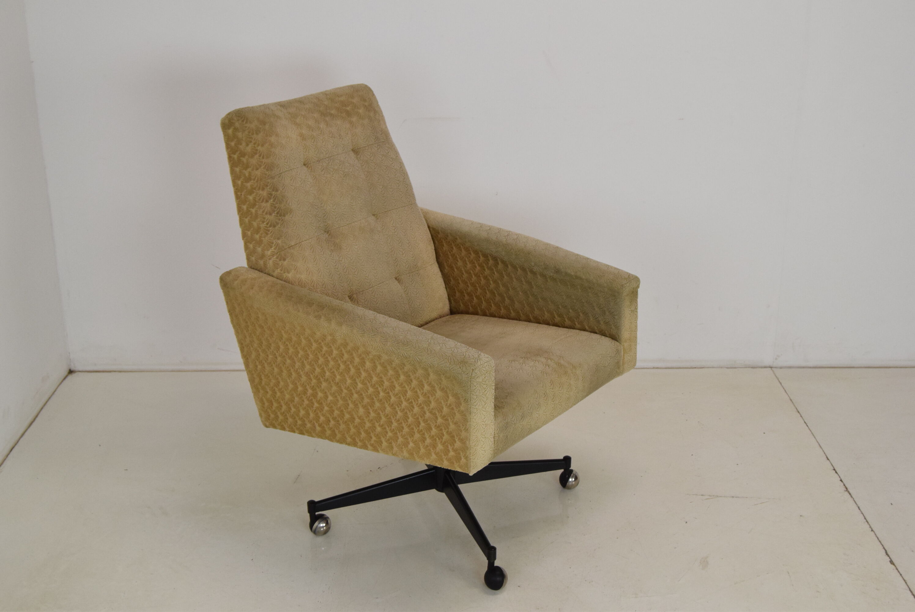 Mid-century swivel armchair with wheels 1970's