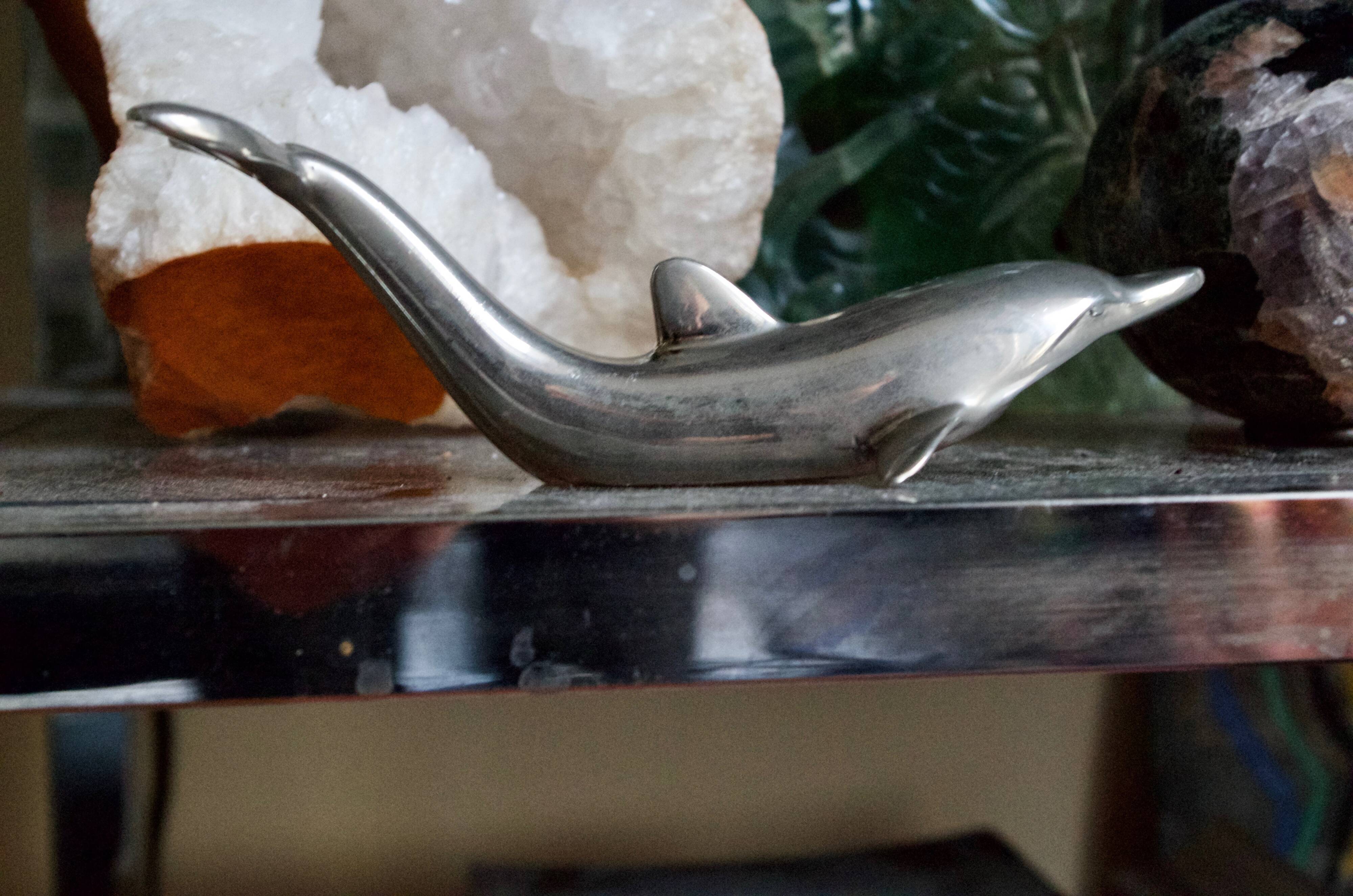 Vintage metal bottle opener dolphin