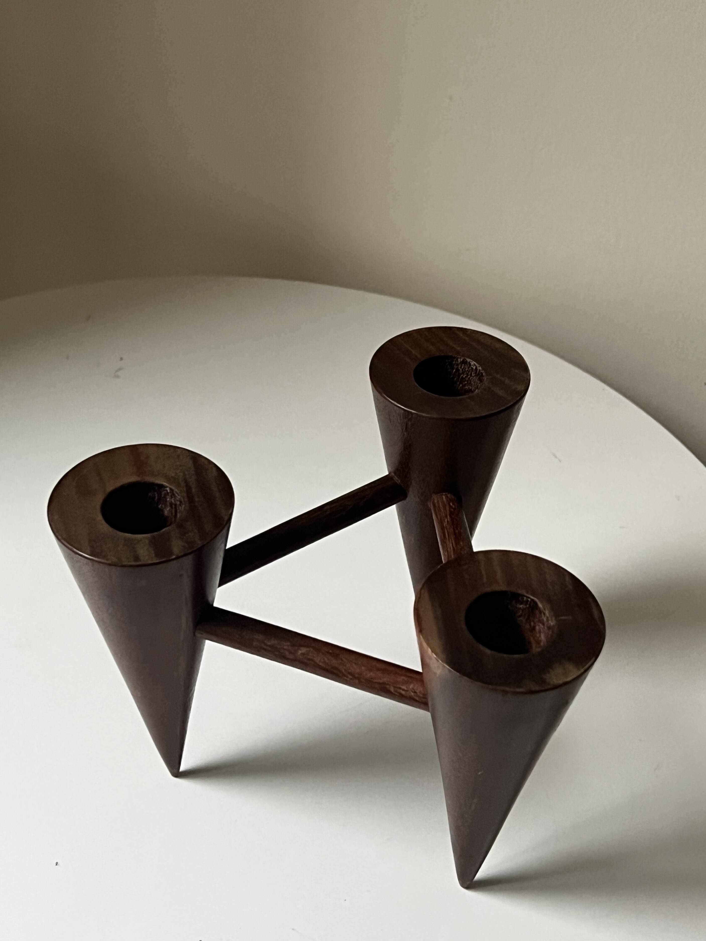 Scandinavian tripod candle holder in carved wood, design from around 1970.