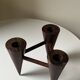 Scandinavian tripod candle holder in carved wood, design from around 1970.