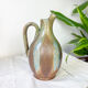 Art Nouveau style carafe in flamed stoneware with blue and brown drips