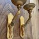 Paire d’appliques murales bronze bras tendus mains