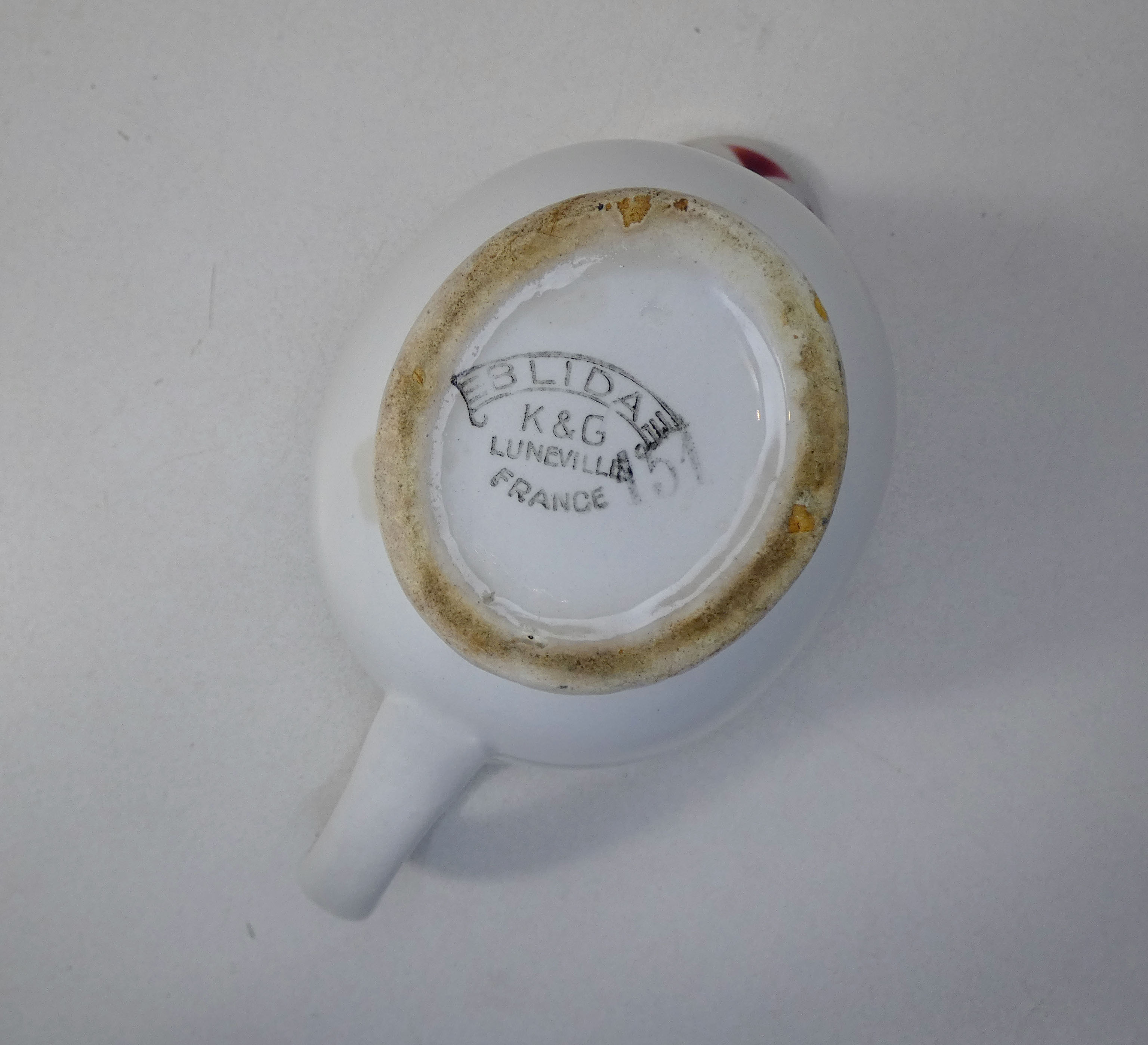 Old creamer milk pot in earthenware of Lunéville