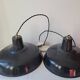 Duo of white and black enameled sheet metal pendants