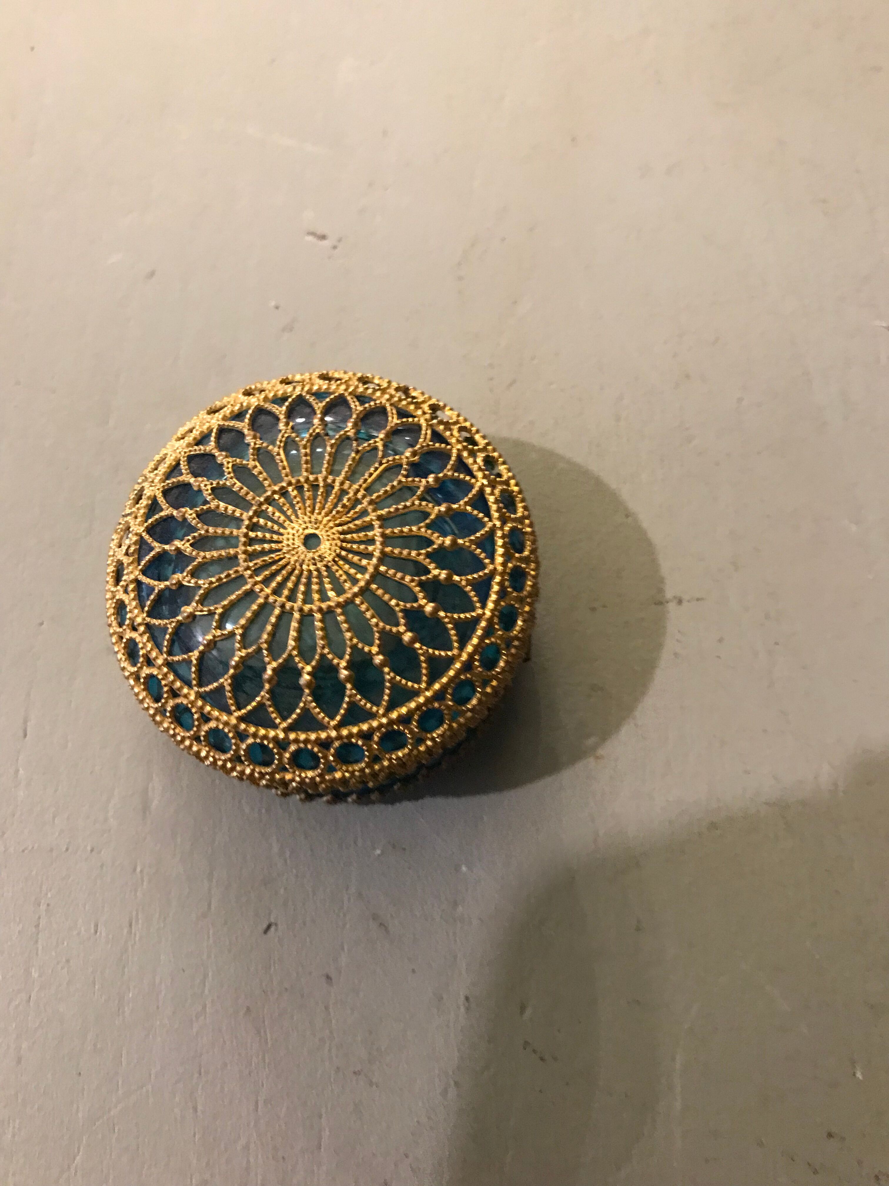 Old pill box made of golden thread