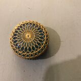 Old pill box made of golden thread