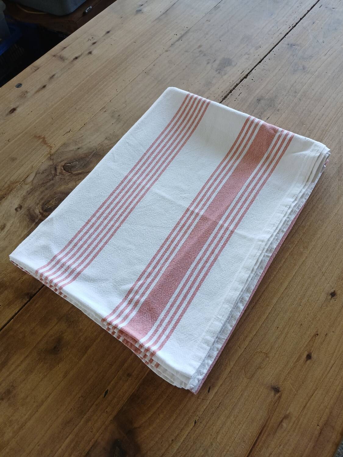 Old pink and white tablecloth
