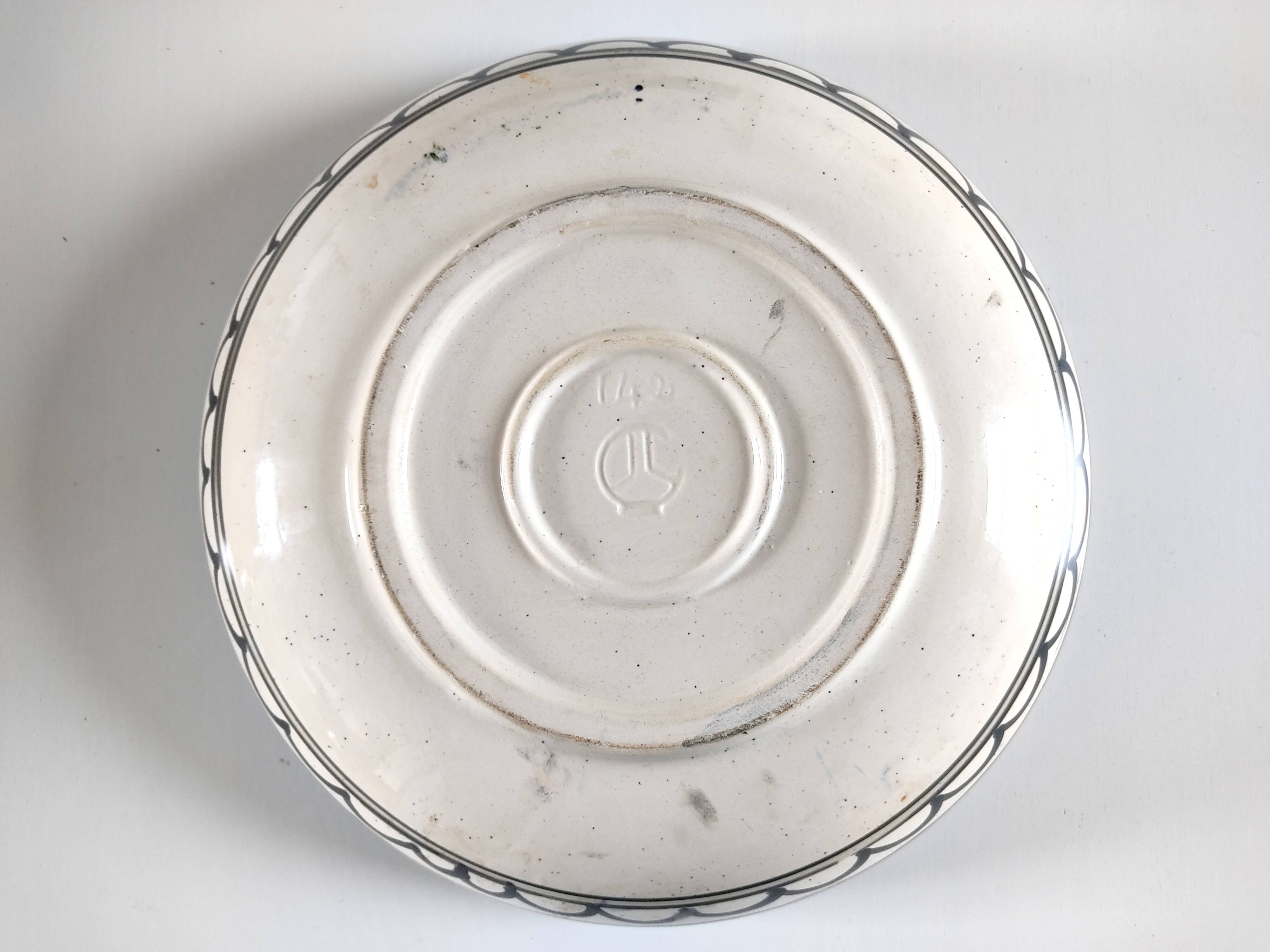 Large decorative dish with colorful peacock