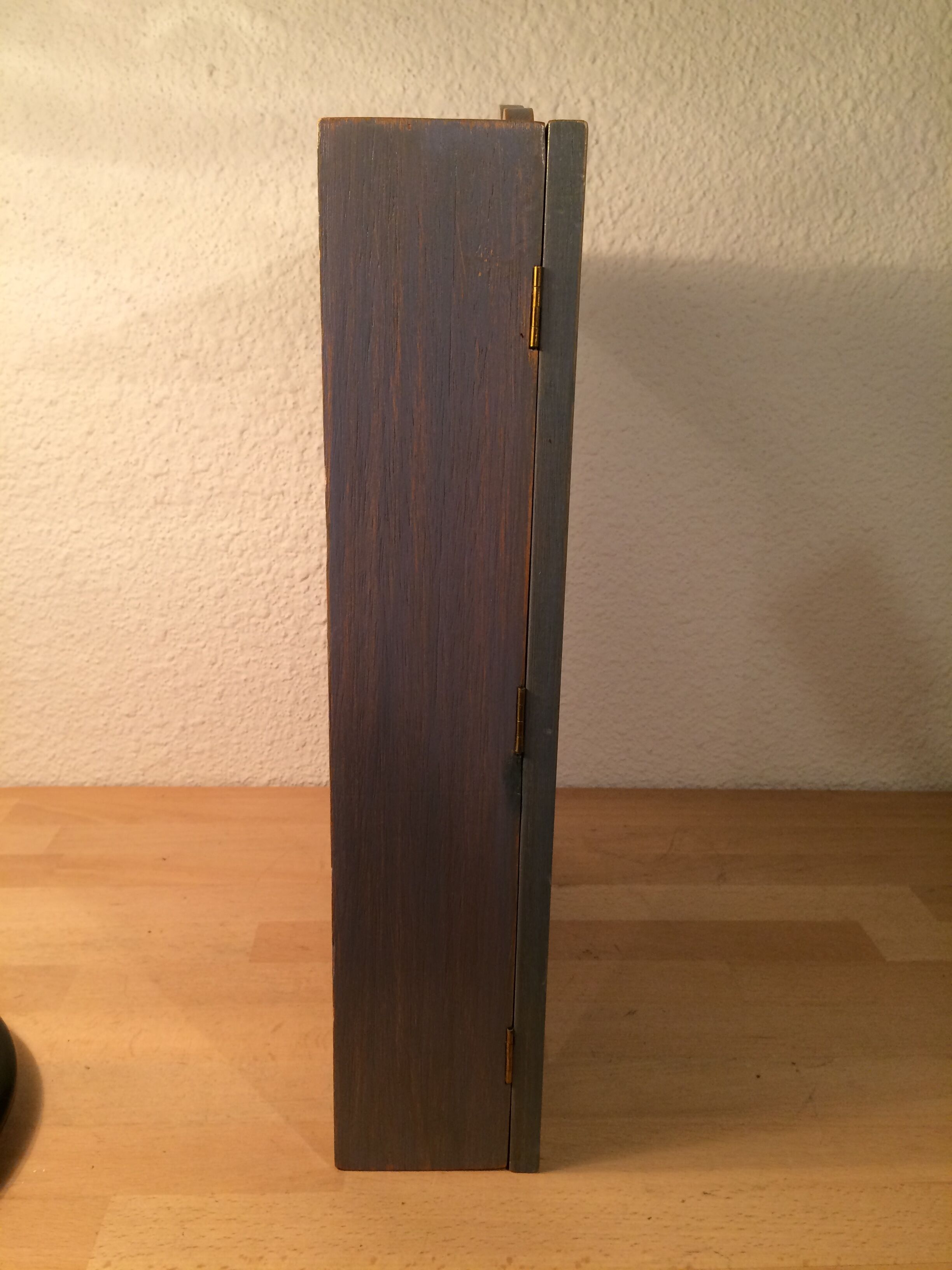 Display shelf with miniature blue wood and mirrors