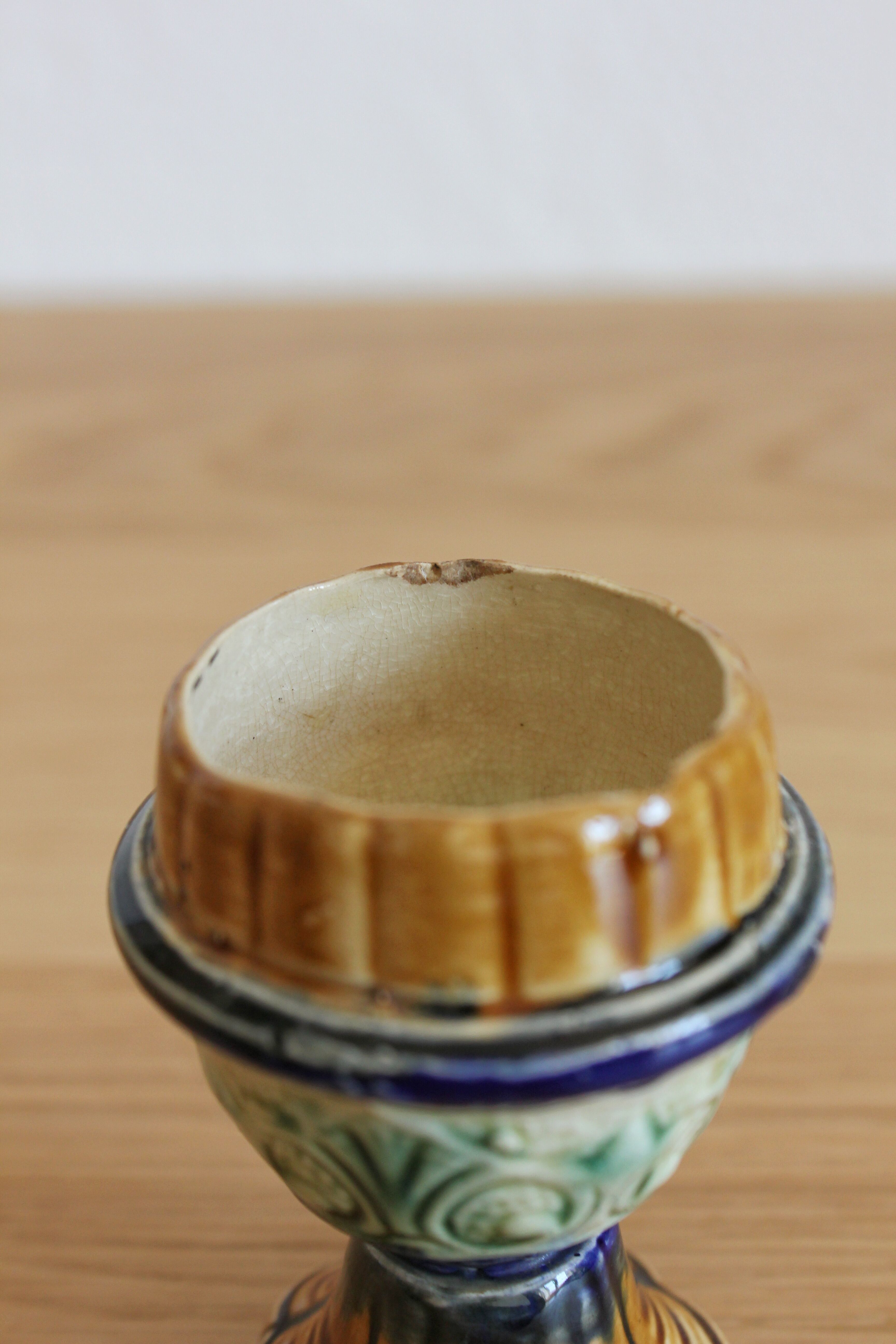 Late 19th-century earthenware egg cup in slipware