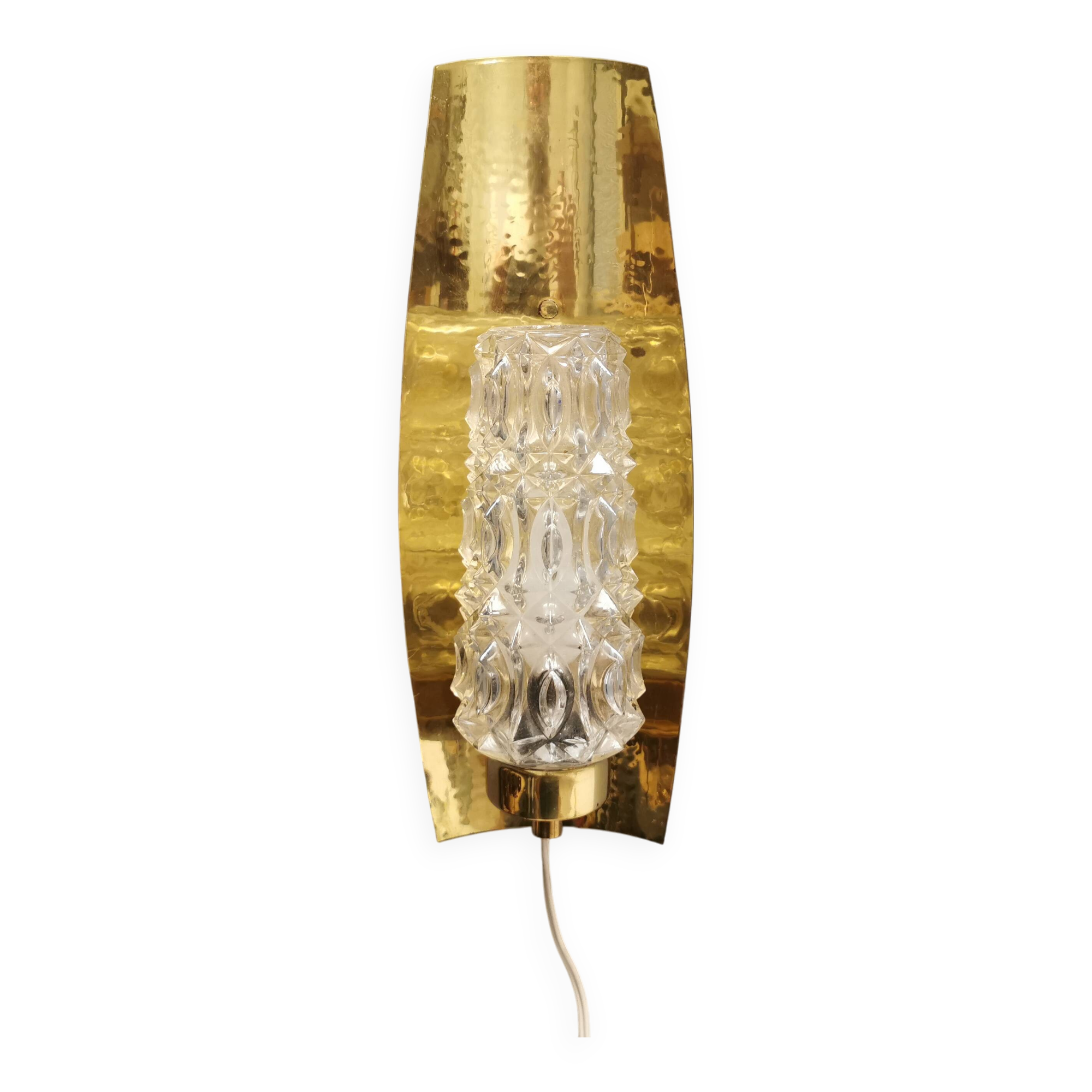 Older wall lamp in brass with hard pressed glass shade.