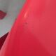 Four red fibreglass chairs from the 1970s.