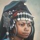 Portrait of a young Moroccan woman in traditional attire and adornments.