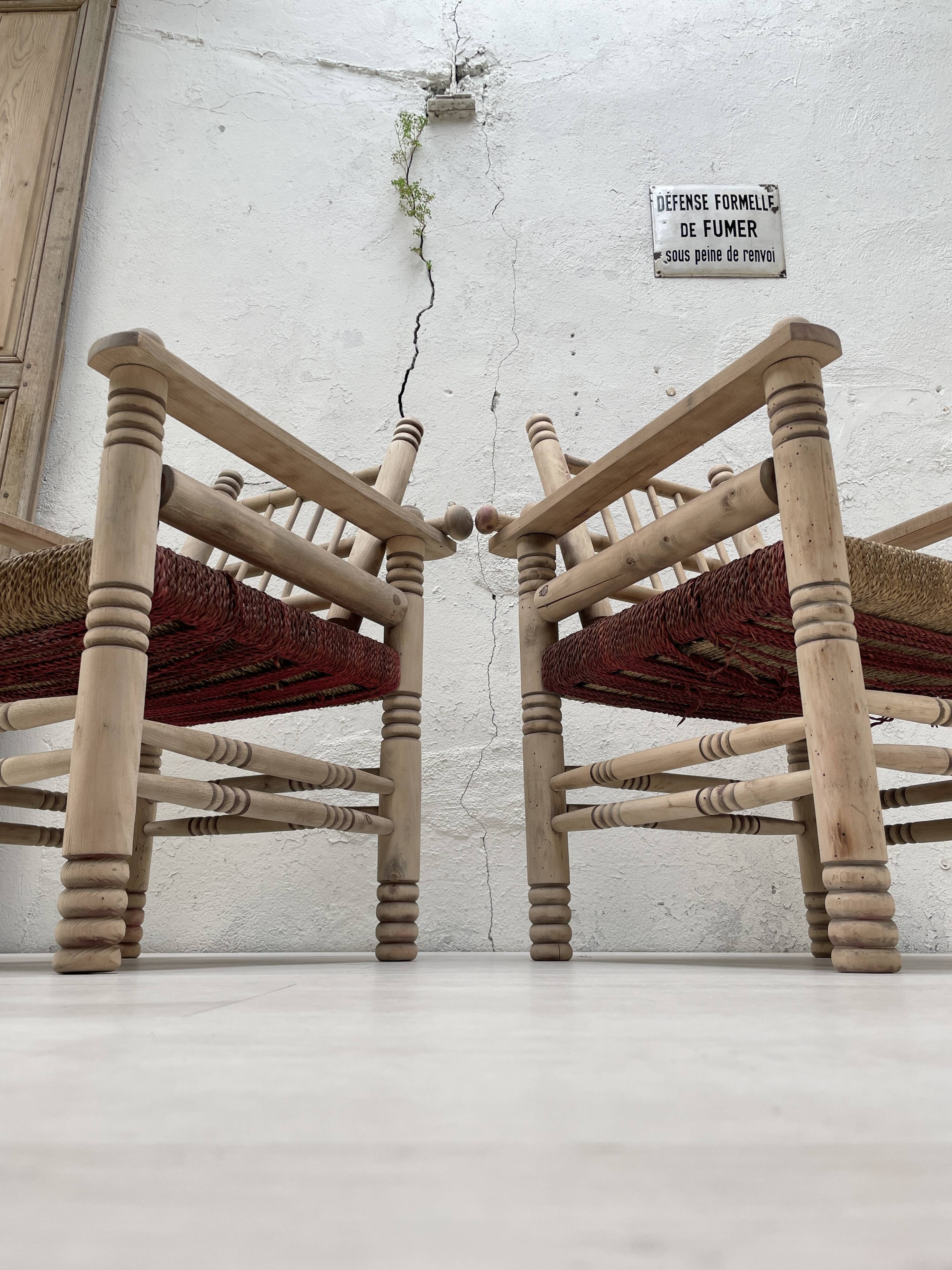 Pair of wooden armchairs and ropes