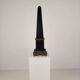 Black porcelain obelisk with bronze ornaments