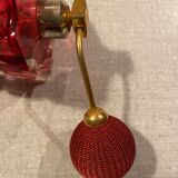Red crystal perfume spray and red pump.