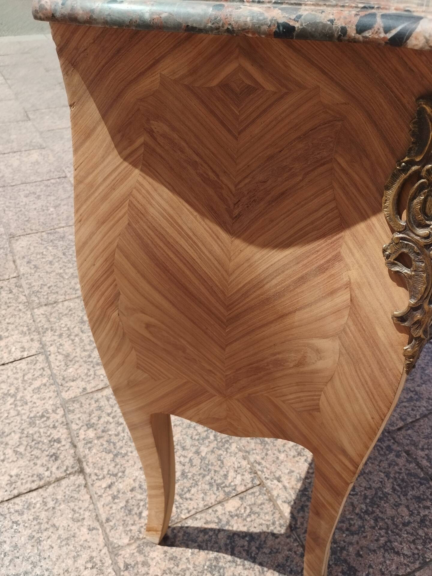 Antique commode in marquetry in the Louis XV style with a marble top.