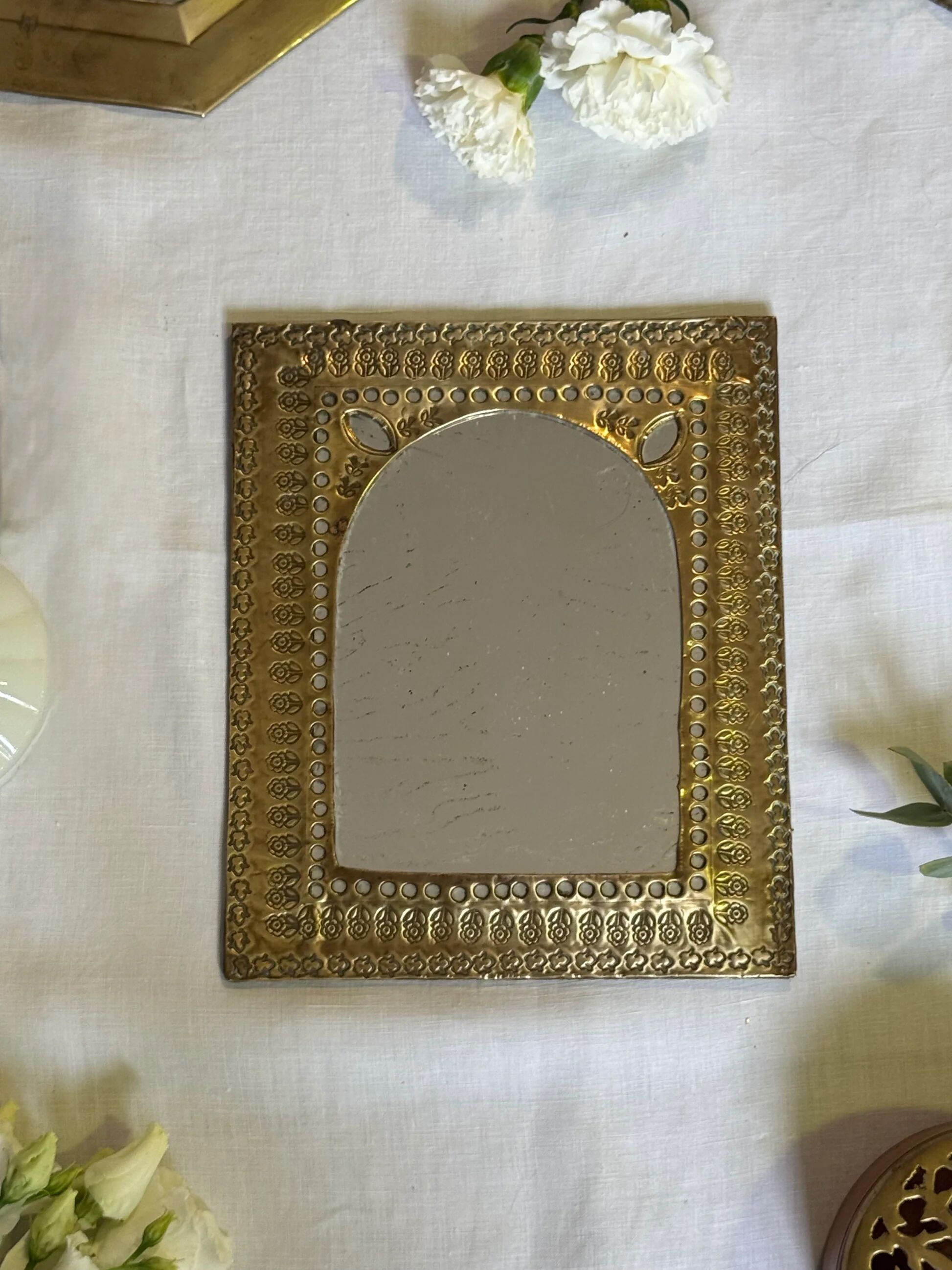Oriental brass mirror