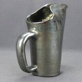 Old Biot, modernist pitcher in iridescent black ceramic.