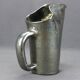 Old Biot, modernist pitcher in iridescent black ceramic.