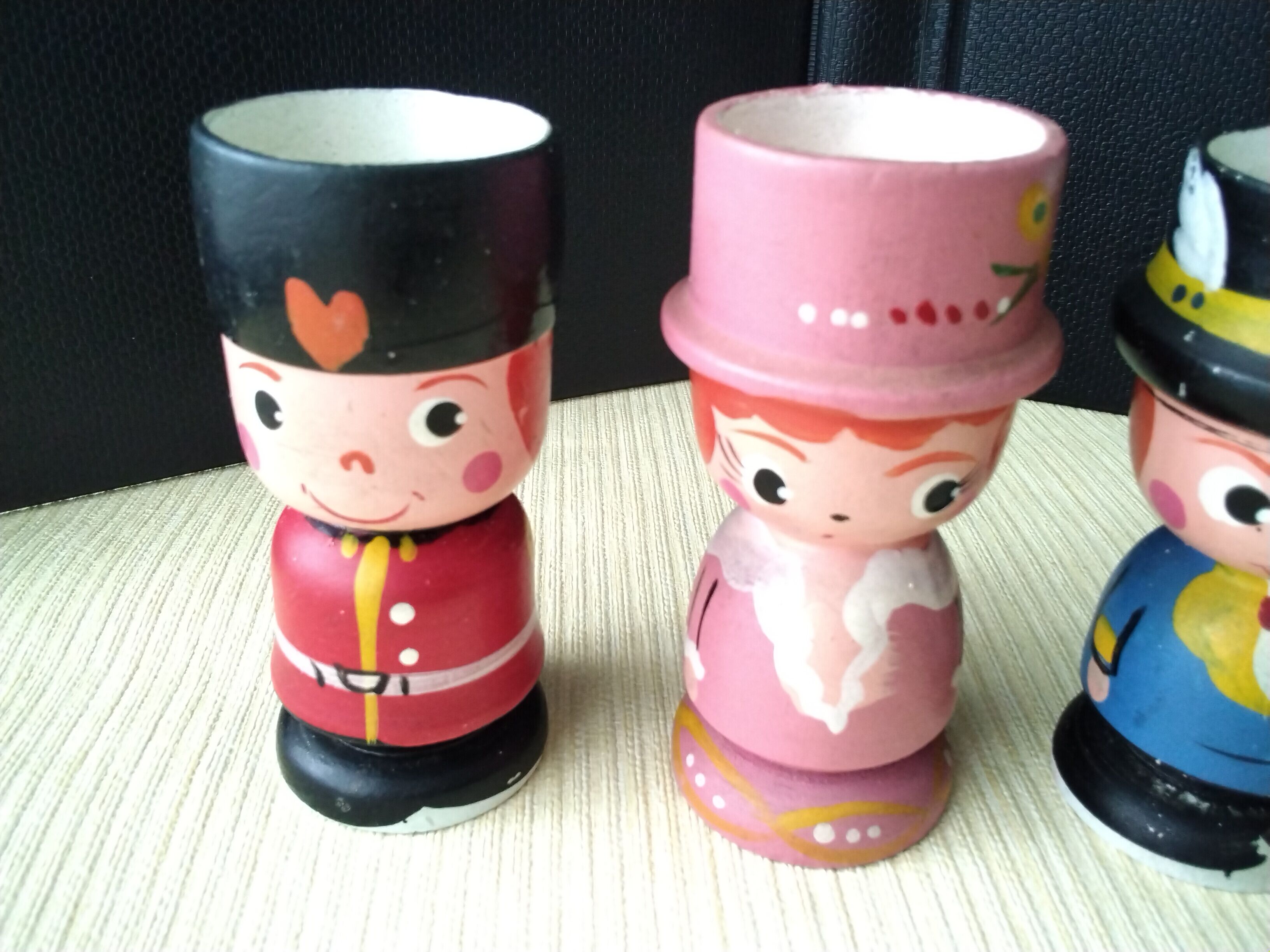 Set of 4 painted wooden characters eggcups