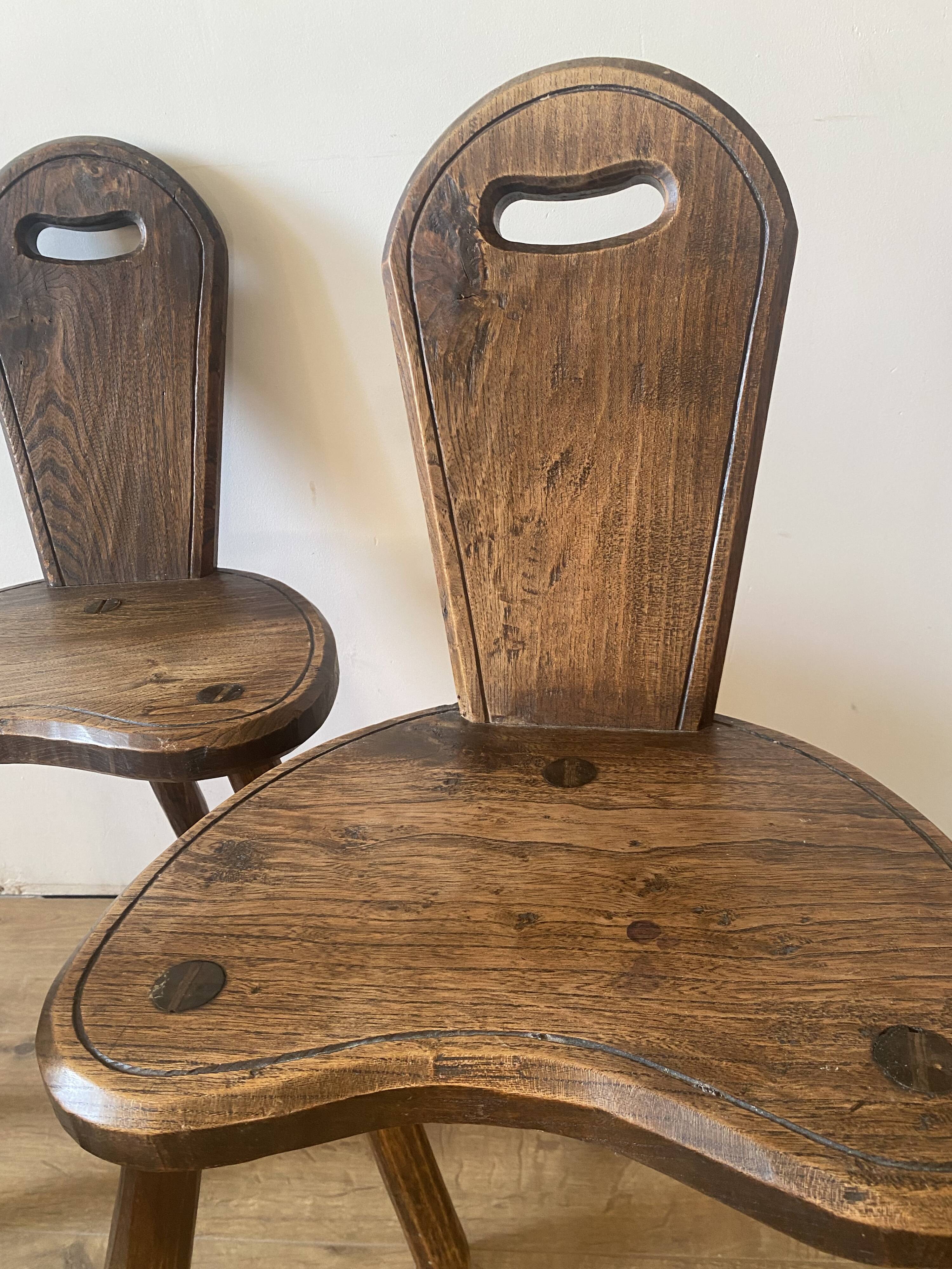 4 brutalist farm tripod chairs