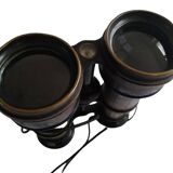 Old brass binoculars with integrated compass