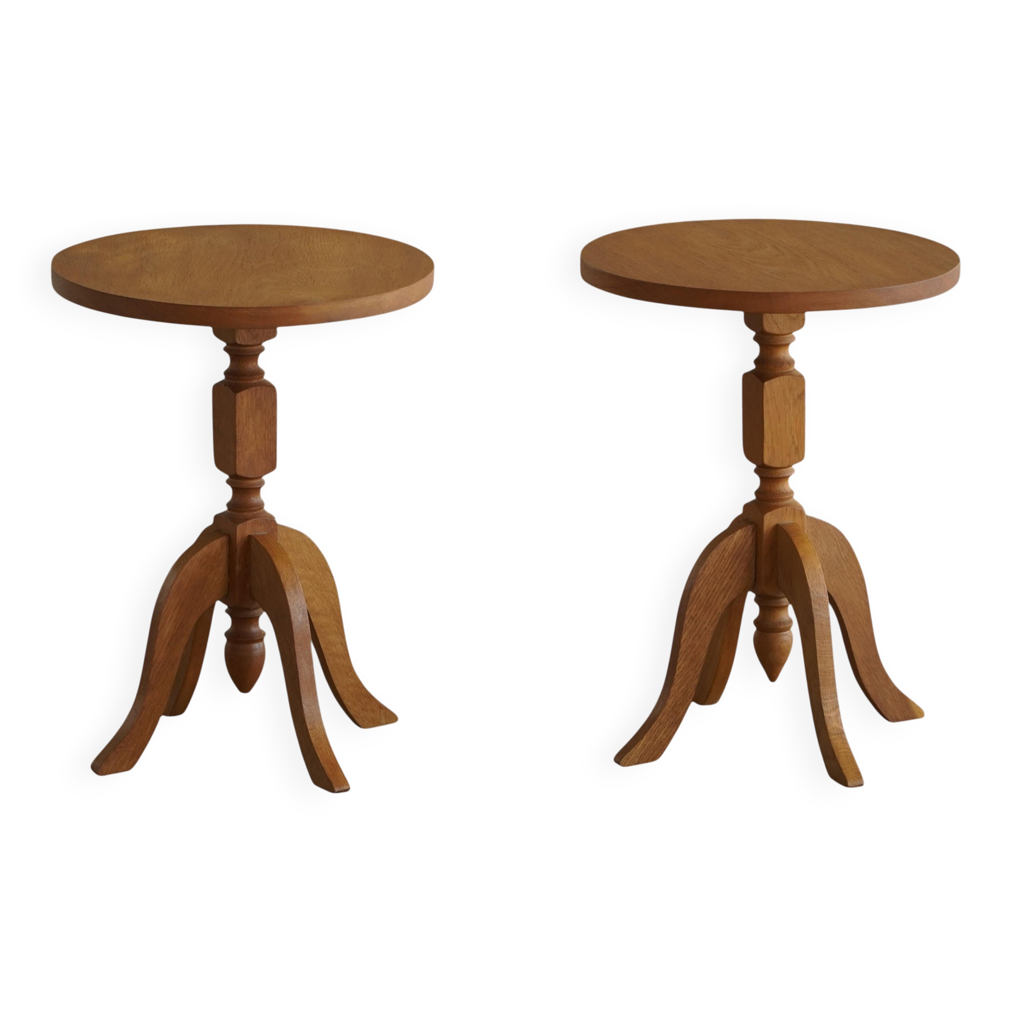 Pair of Scandinavian oak side tables with central legs and sculptural curved feet, 1960s.