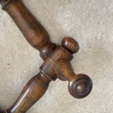 Wall-mounted accordion coat rack made of turned wood