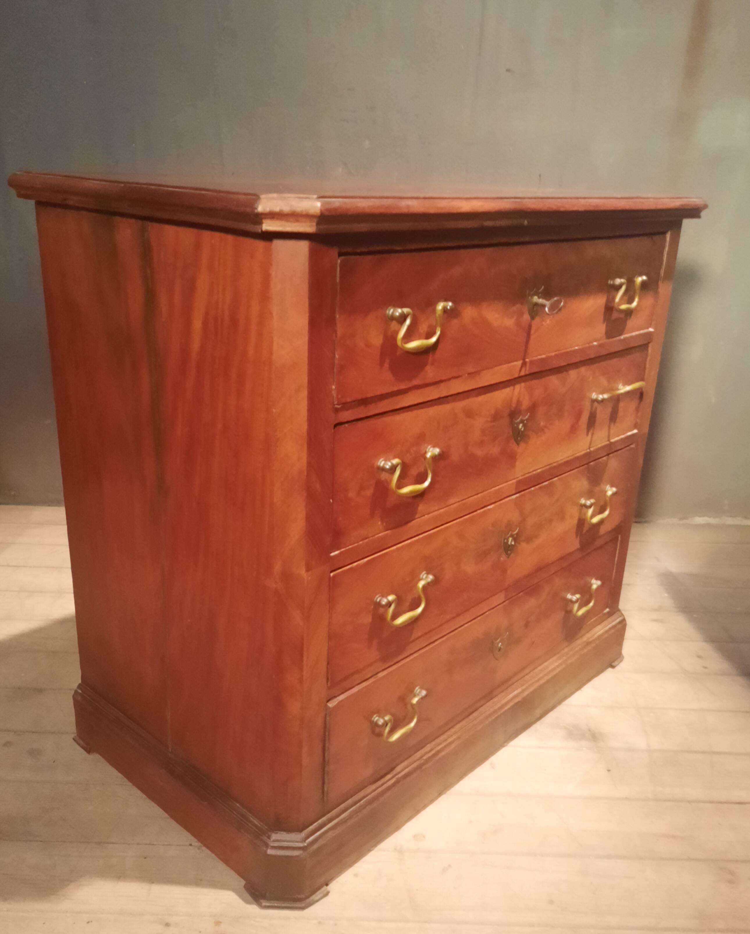 Small Louis Philippe chest of drawers with cut corners.