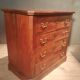 Small Louis Philippe chest of drawers with cut corners.
