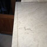 Antique wood and marble kitchen sideboard with carved backsplash