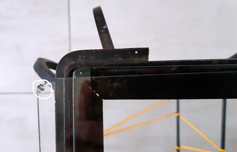 Vintage magazine holder "scoubidou" in black wrought iron.