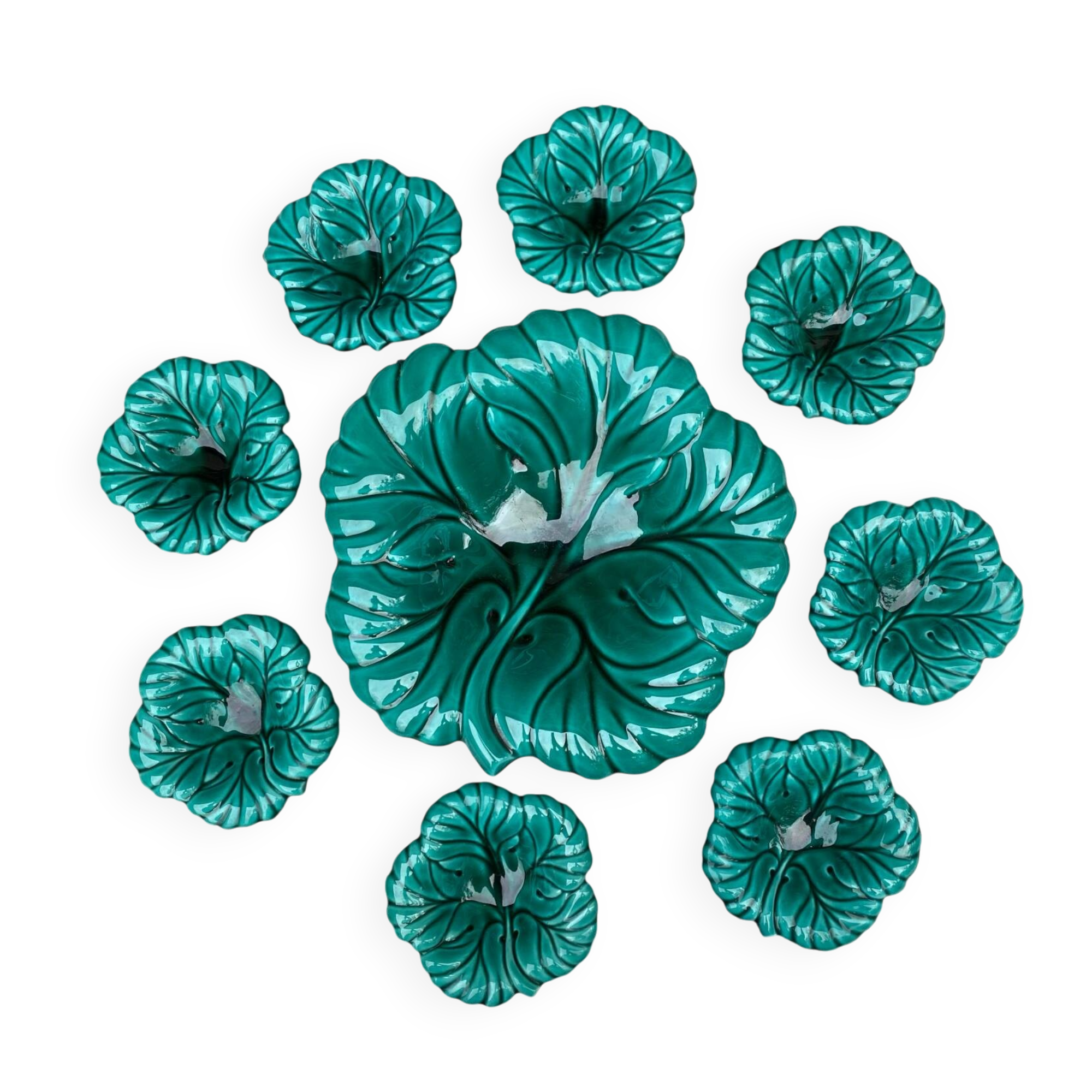 Salad bowl and small bowls in leaf-shaped slipware