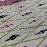 Handmade geometric patterned rug in natural wool