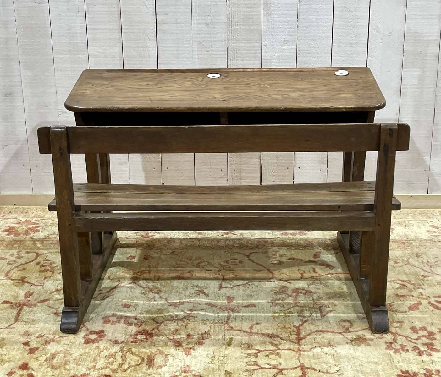 Early 20th-century oak school desk with porcelain inkwells