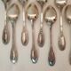 12 small silver metal spoons Orbrille