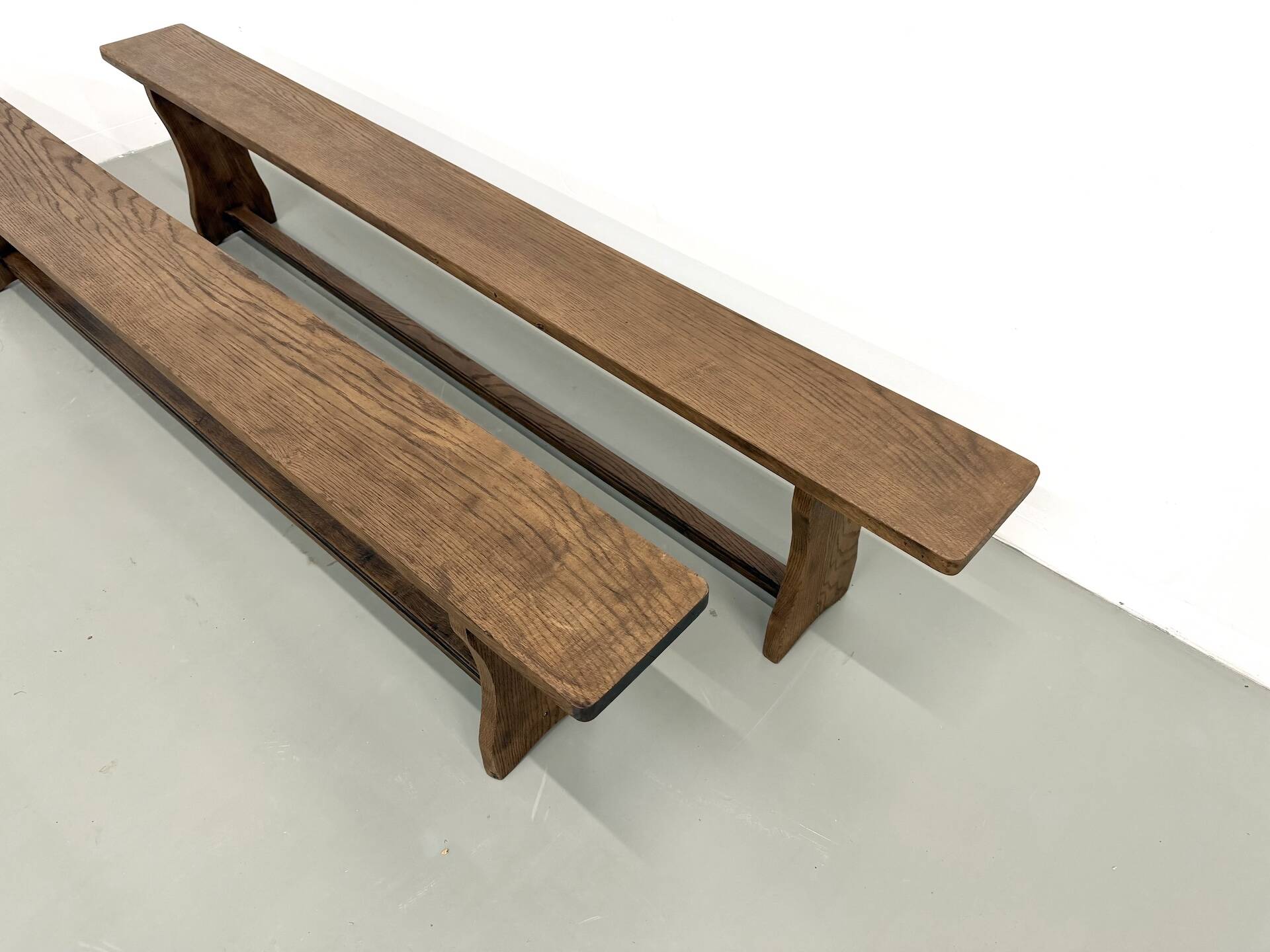 Pair of solid oak benches, winged legs, France, 1970s