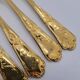 12 Table Forks in gold metal