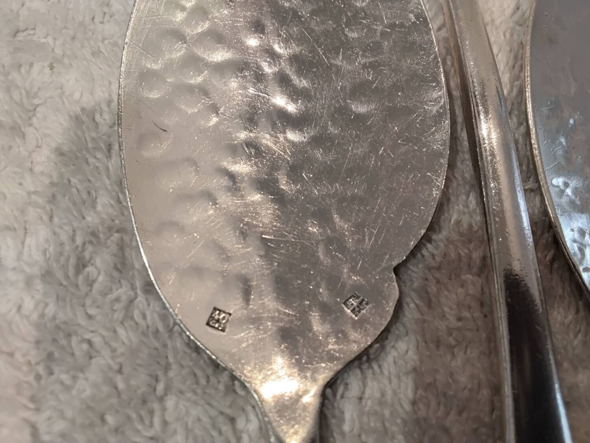 6 individual silver-plated metal sauce spoons with hammered baguette handles