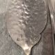 6 individual silver-plated metal sauce spoons with hammered baguette handles