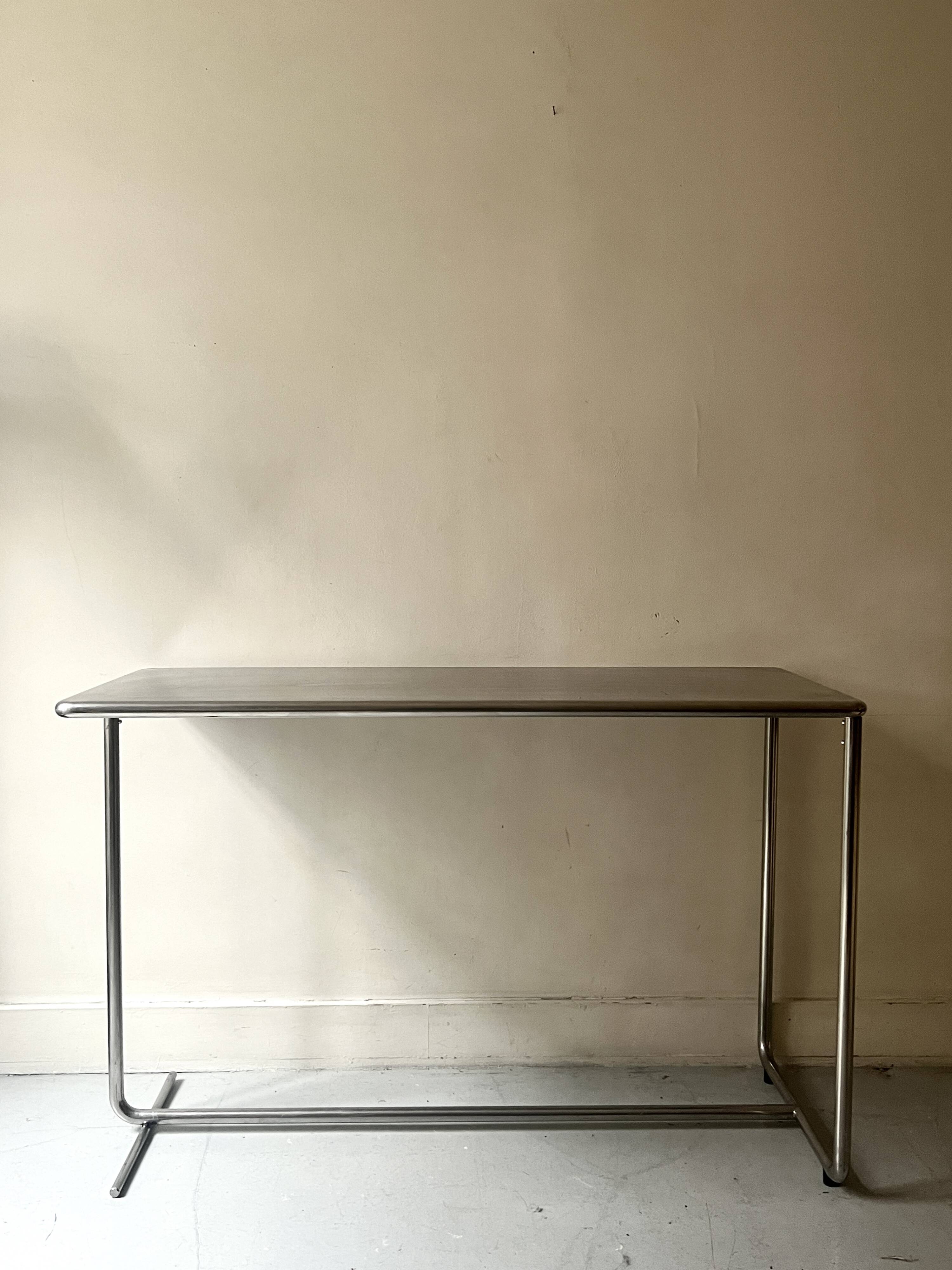 Dining table / tubular and modernist desk in chrome metal