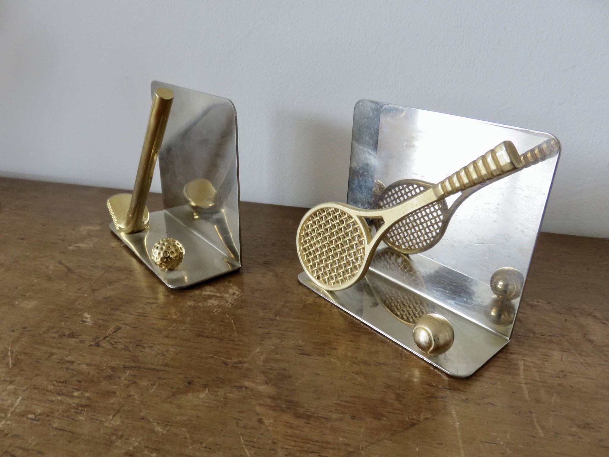 Chrome and brass bookends "tennis & golf" from the 1970s.