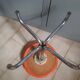 Vintage 70's rotating stool, chrome base, orange imitation leather seat