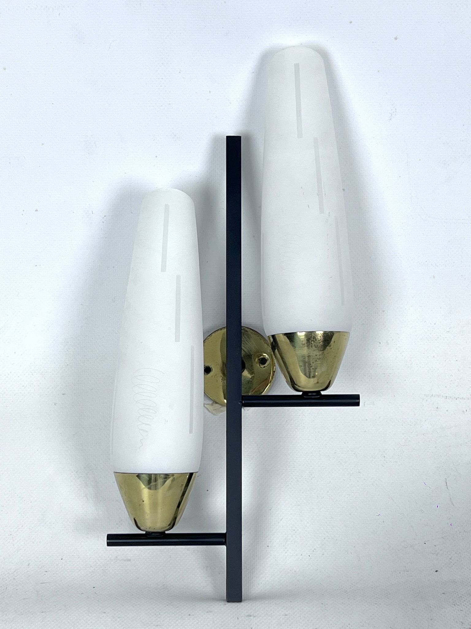 Mid-Century pair of double lights sconces in brass and opaline glass. Italy 1950s
