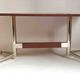 Vintage coffee table from the 1950s in mahogany and metal, with a tabletop width of 110 cm.