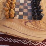 Rustic handmade chessboard made of olive wood