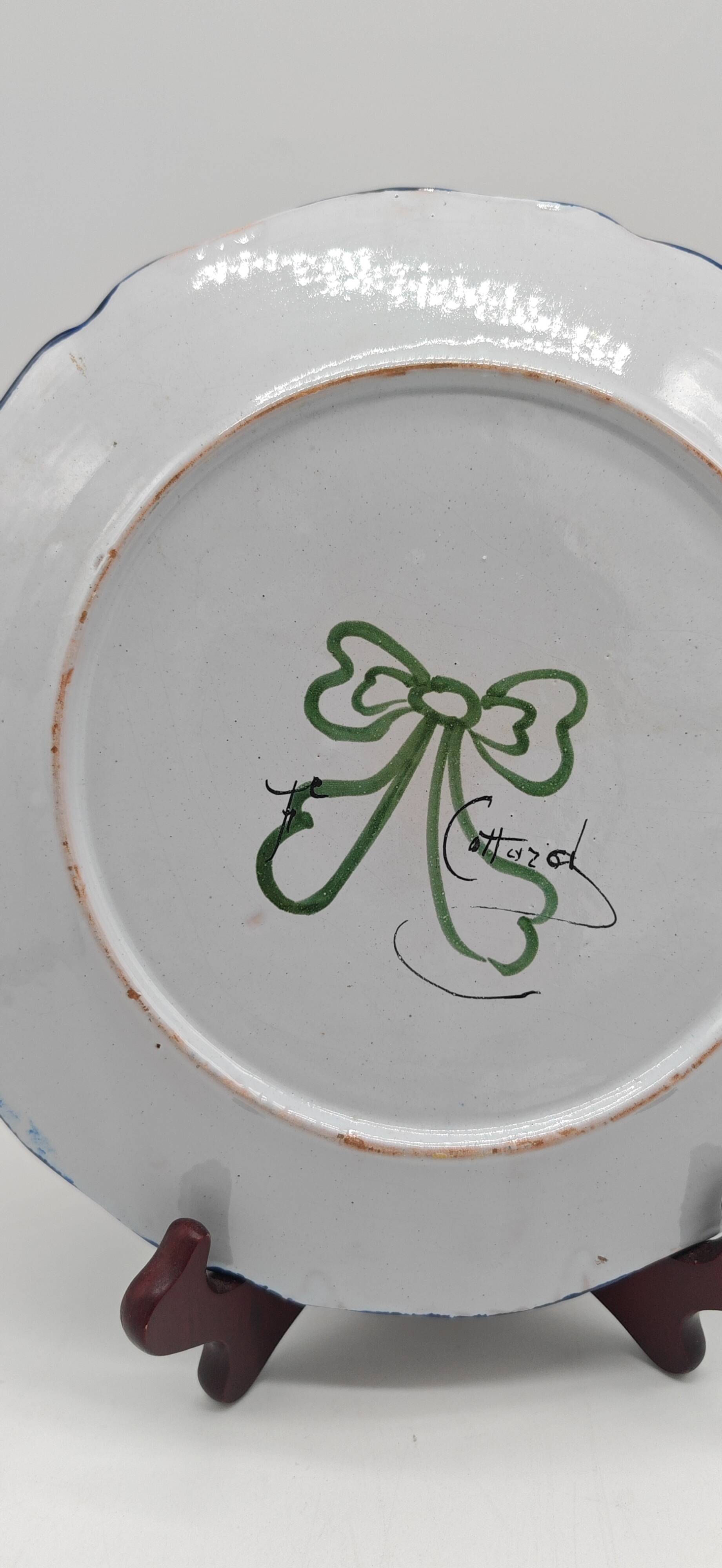 Pair of Nevers earthenware plates signed Félicien Cottard between 1898 and 1908