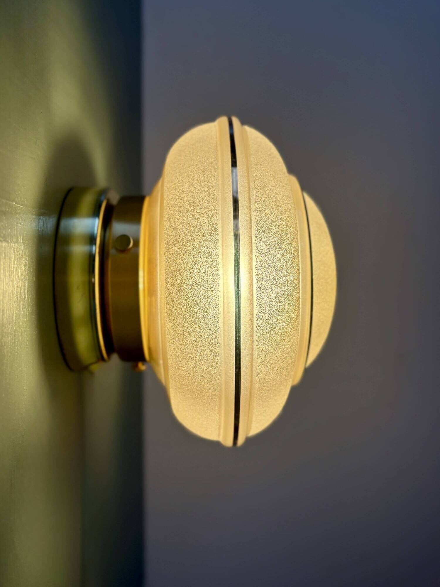 Vintage Art Deco globe wall/ceiling light in frosted yellow and gold glass.